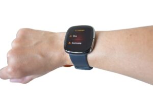 Fitbit Sense looks on hand model ( Garmin Venu vs Fitbit Sense )